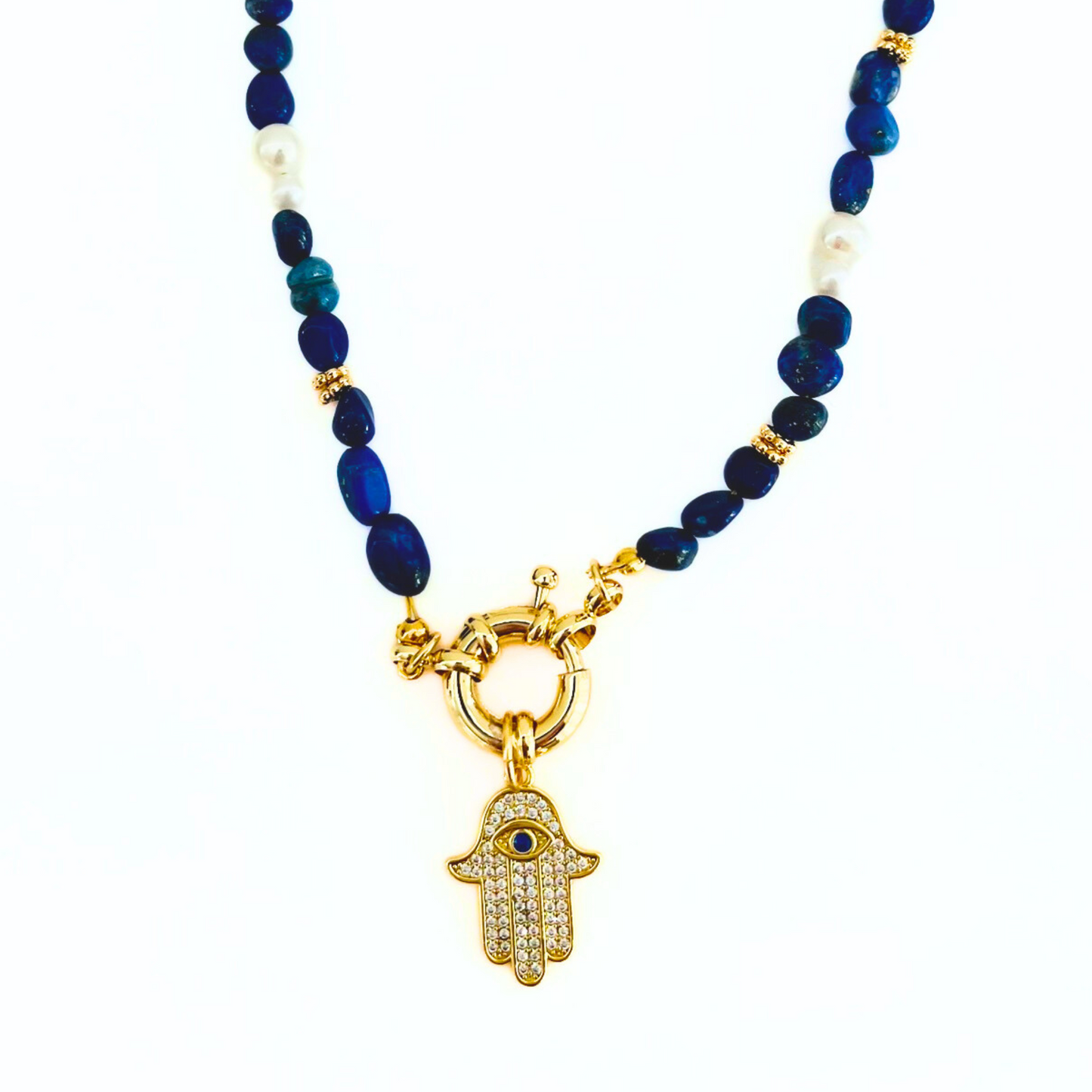 blue Lapis Lazuli Gemstone Necklace with a CZ Hamsa Hand Evil Eye Pendant on a white background