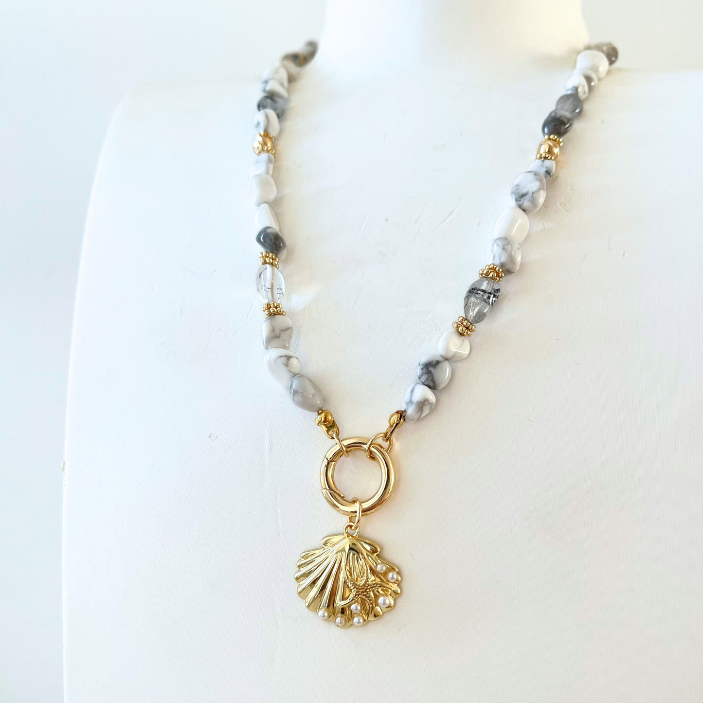Howlite Gemstone Necklace with gray beads and a gold shell pendant