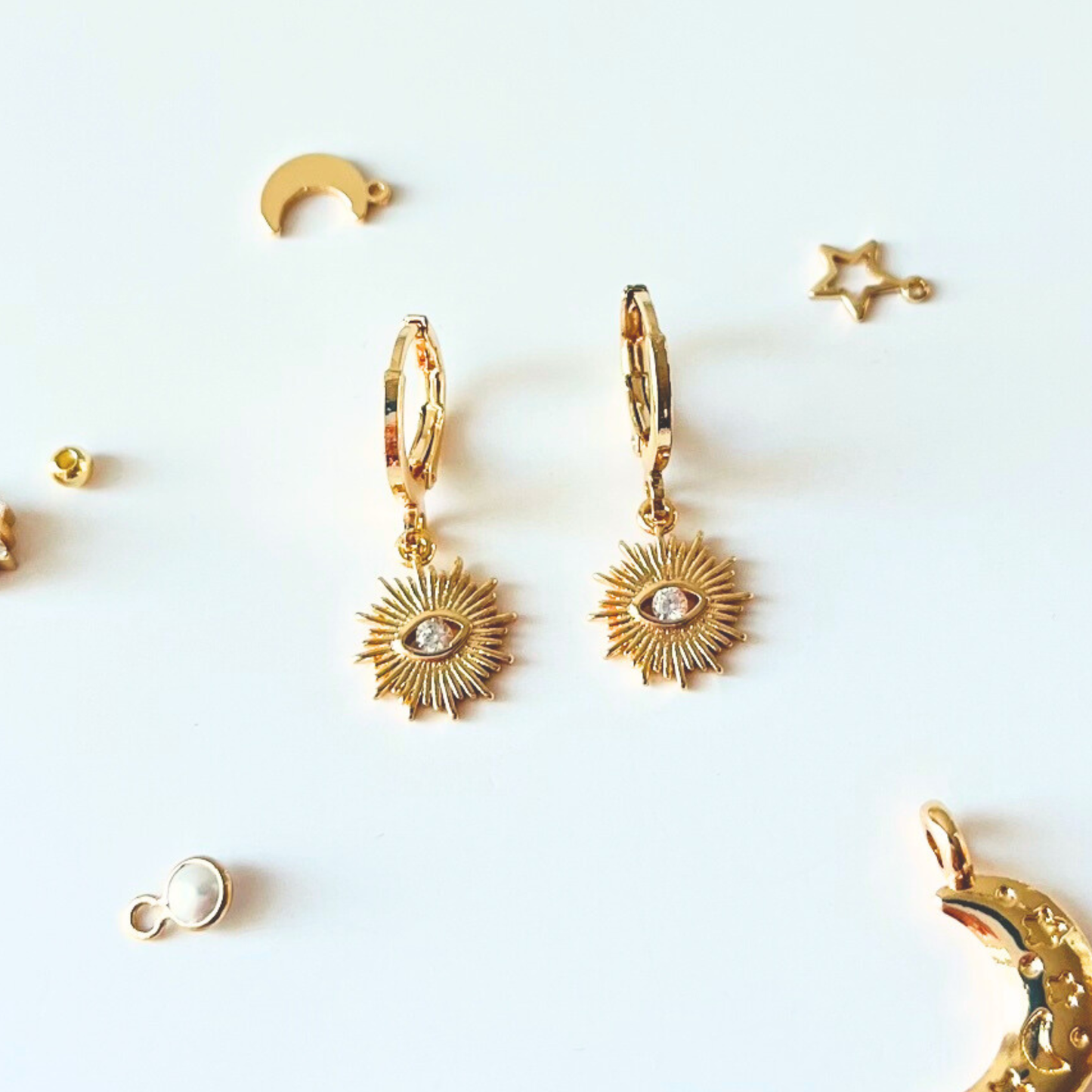 Sunburst Evil Eye Huggie Earrings | Blue & Clear CZ | 14K Gold Plated Earrings