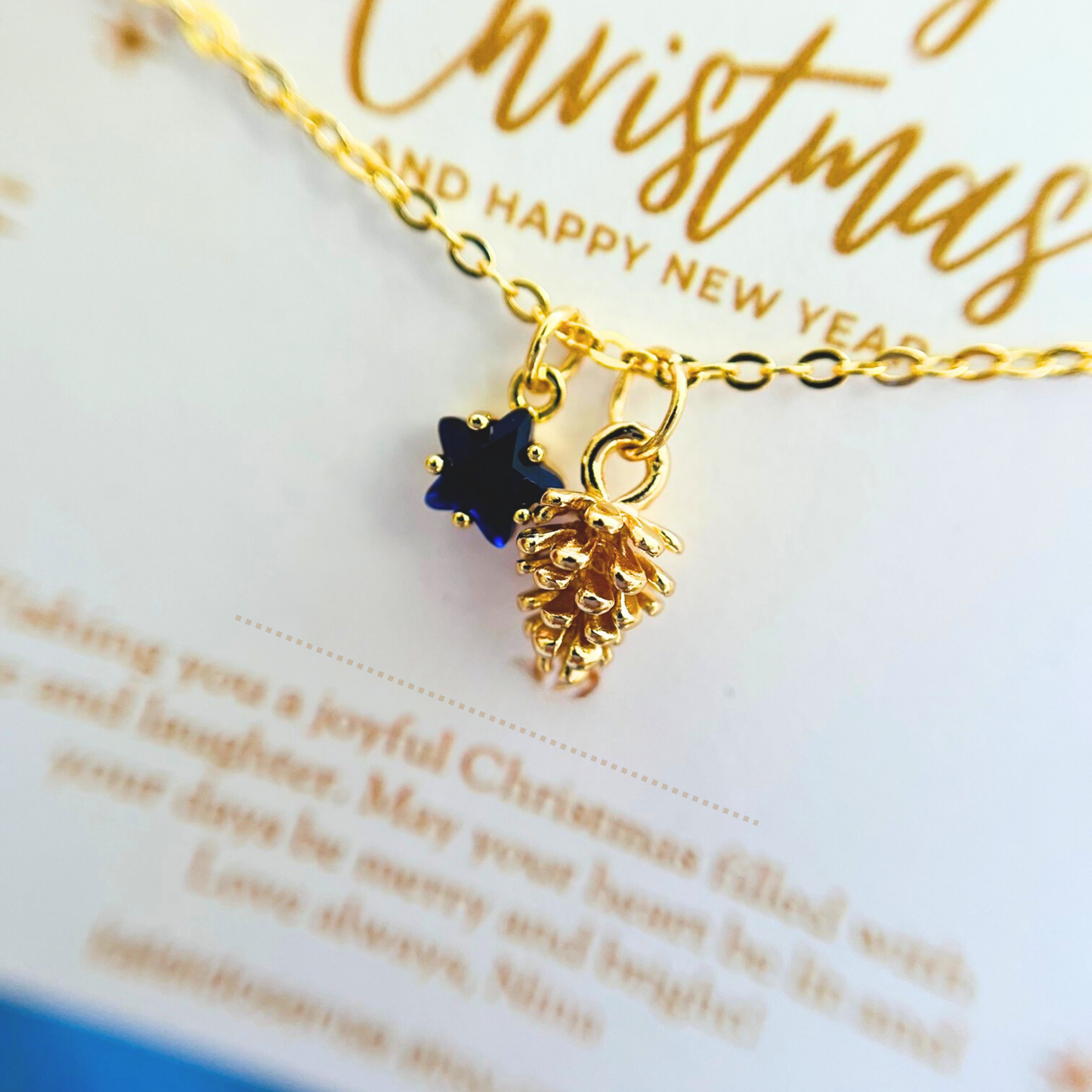 Blue Star Christmas Necklace with Gold Card - Snowflake, Pinecone & Reindeer Charm