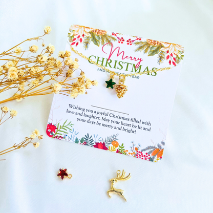 Green Star Christmas Necklace - Snowflake, Pinecone & Reindeer Charm