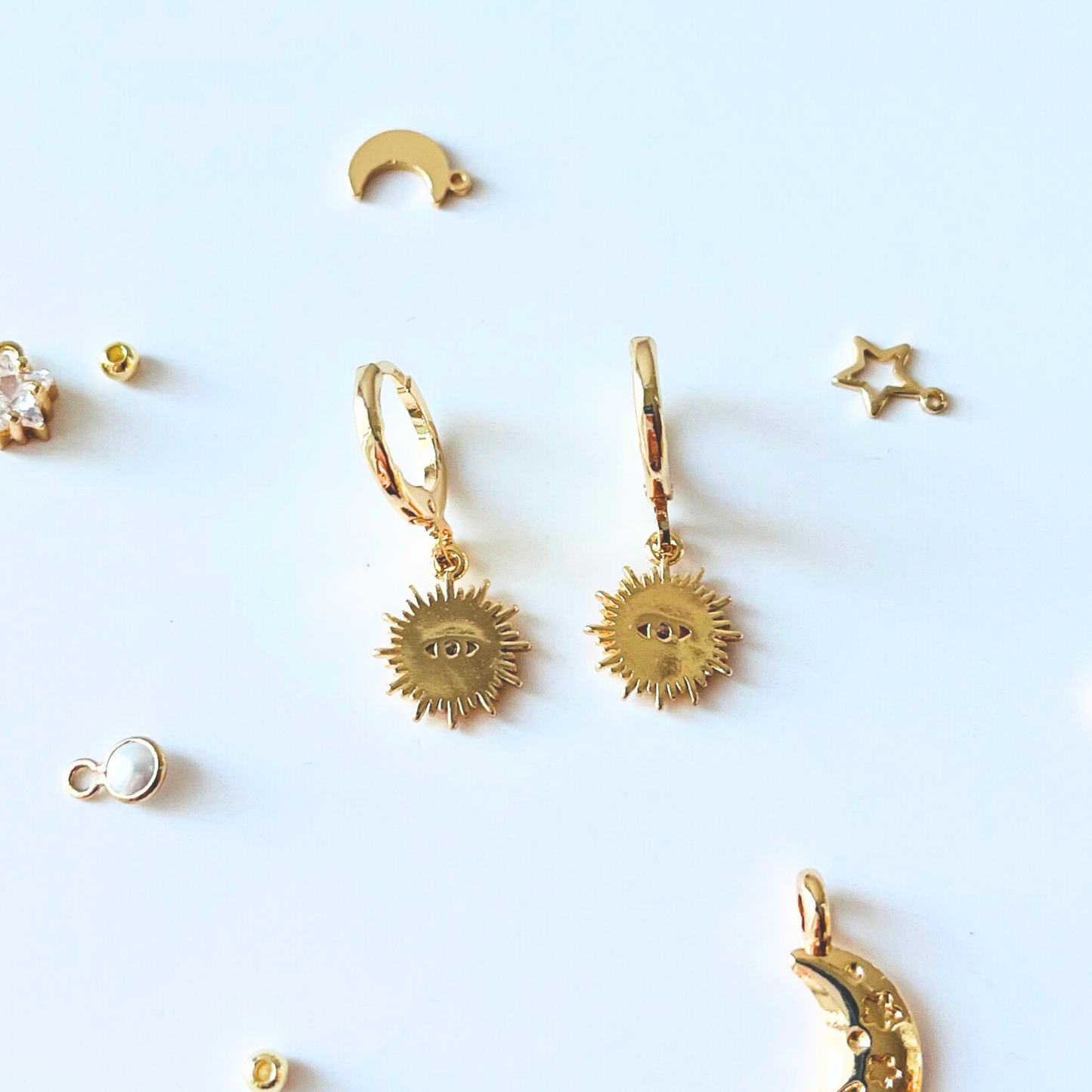 Sunburst Evil Eye Huggie Earrings | Blue & Clear CZ | 14K Gold Plated Earrings