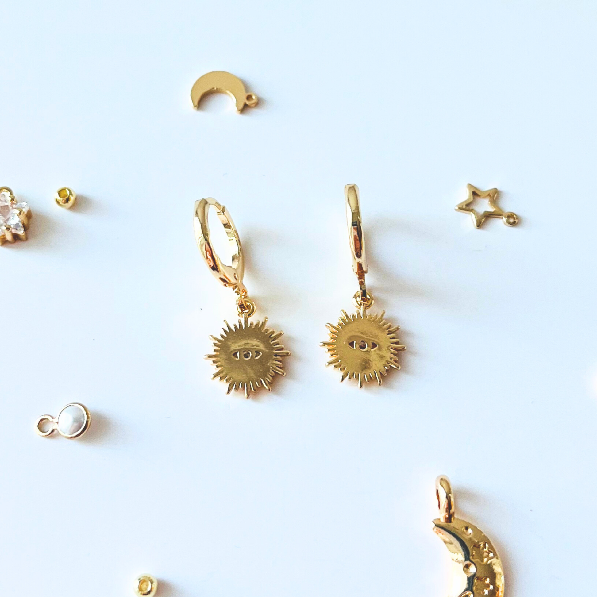 Sunburst Evil Eye Huggie Earrings | Blue & Clear CZ | 14K Gold Plated Earrings