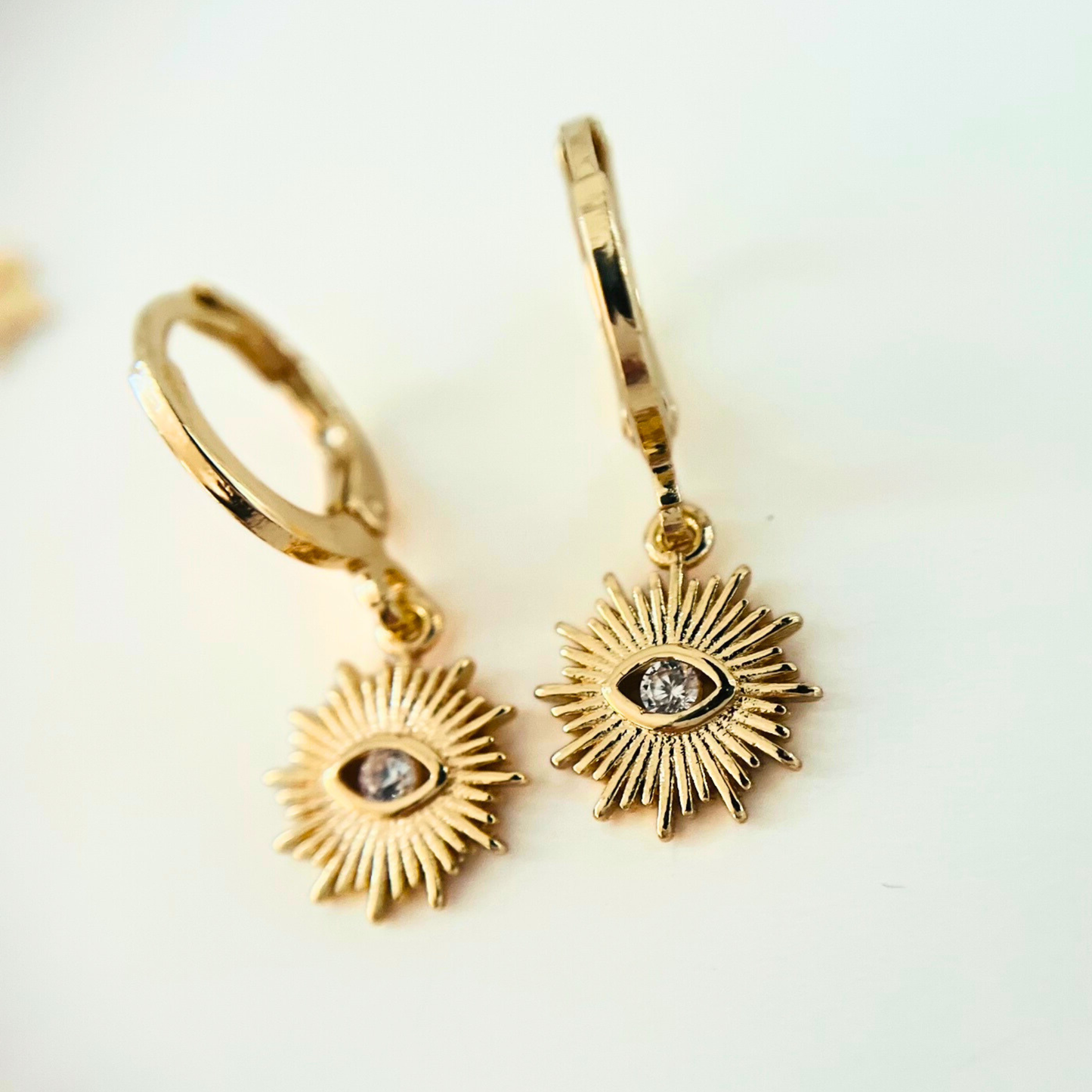Sunburst Evil Eye Huggie Earrings | Blue & Clear CZ | 14K Gold Plated Earrings