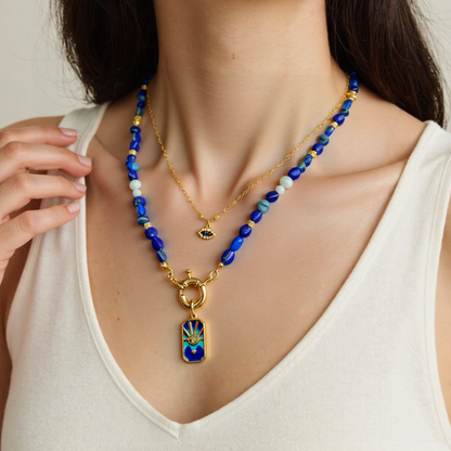 Woman wearing a blue Lapis Lazuli Gemstone Necklace with a Blue Enamel Evil Eye Star Gold Plated Pendant 