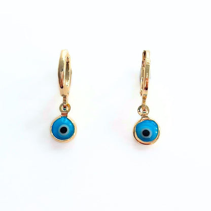Gold plated hoop earrings with blue evil eye charms on a white background