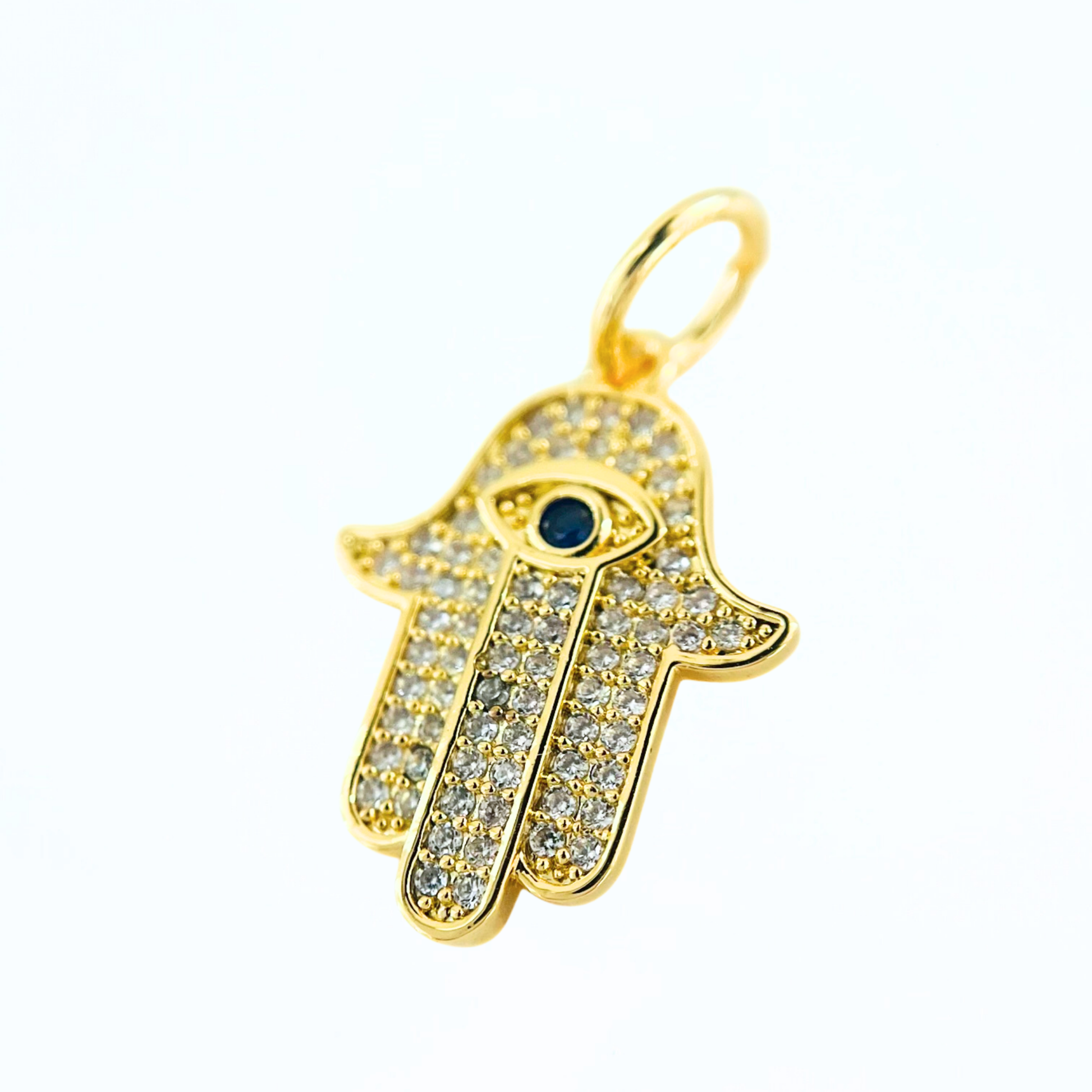 CZ Hamsa Hand Evil Eye Pendant on a white background