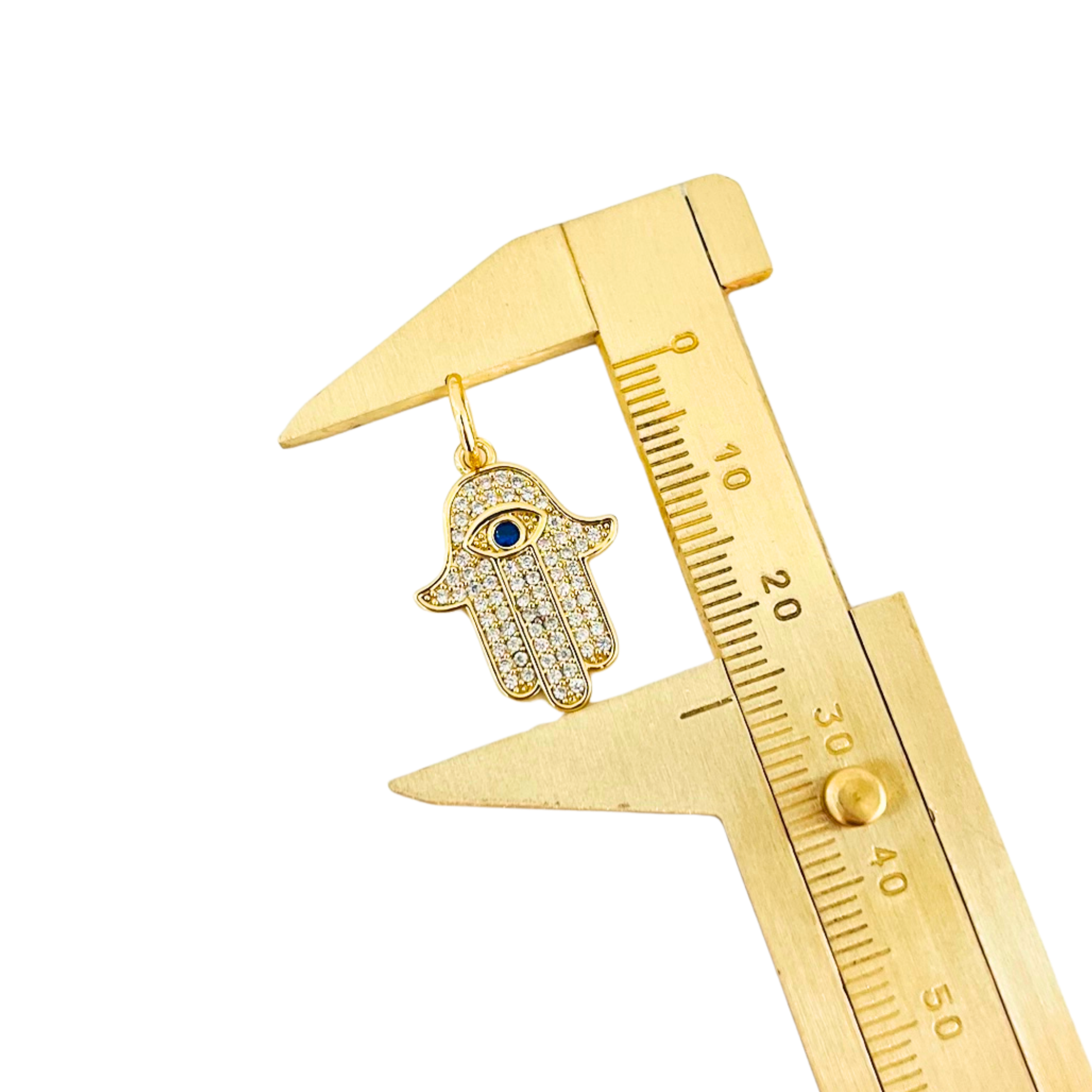 CZ Hamsa Hand Evil Eye Pendant on a gold caliper for scale