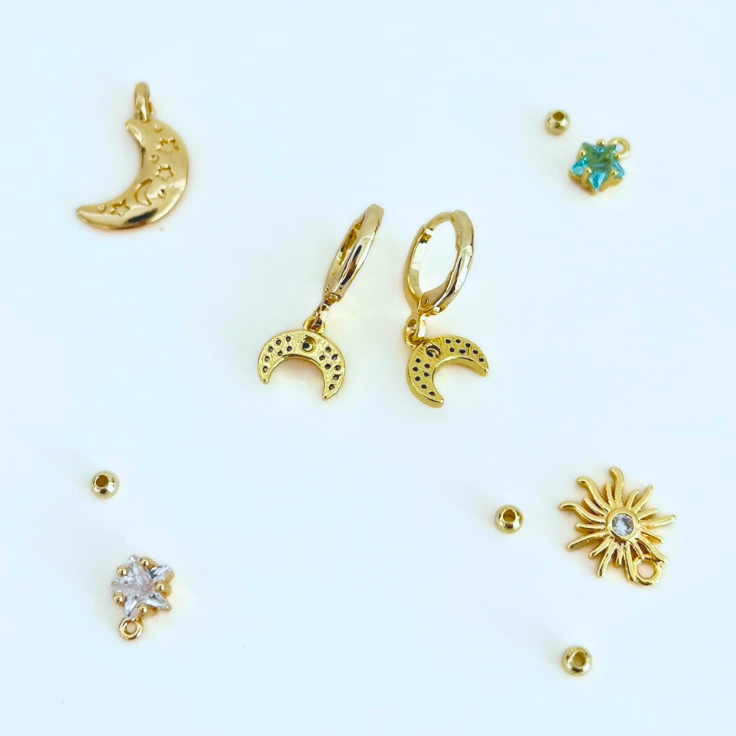 CZ Moon Gold Plated Huggie Hoops earrings back on a white background