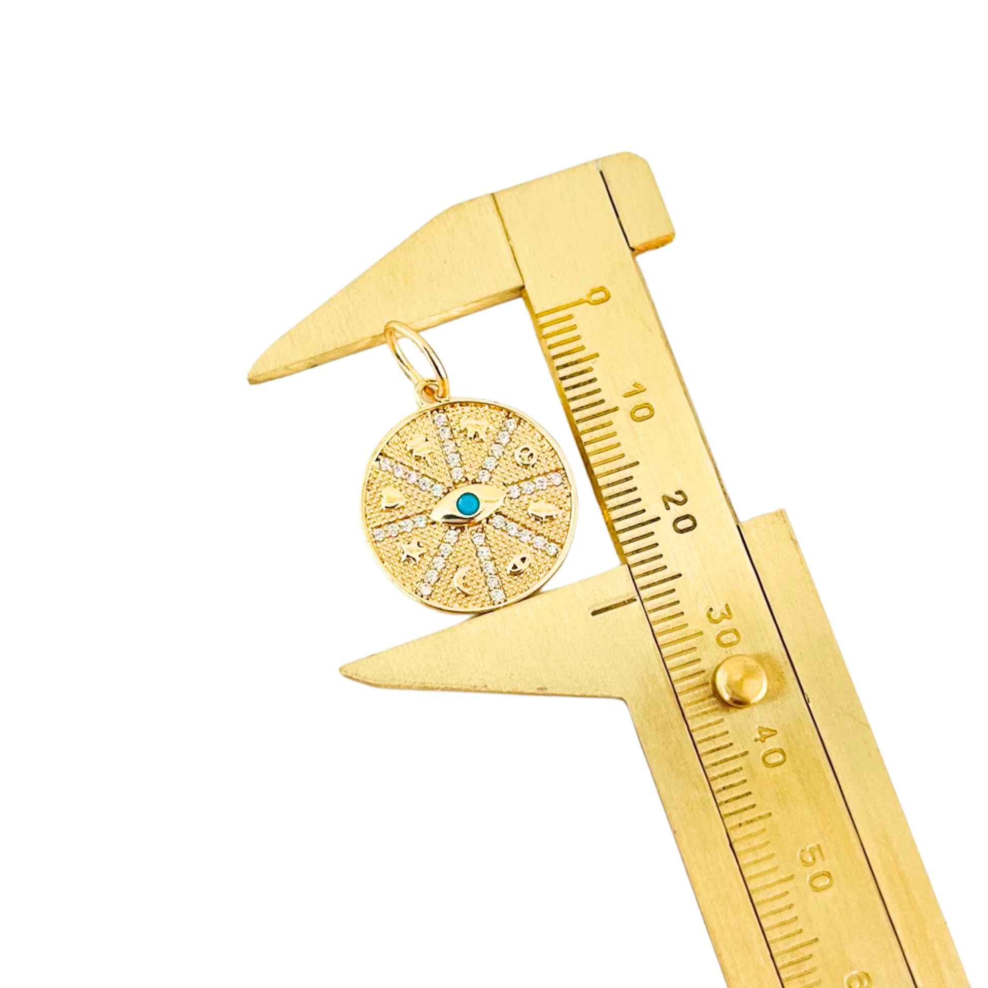 CZ Turquoise Evil Eye Symbols Round Pendant being measured by a gold caliper on a white background