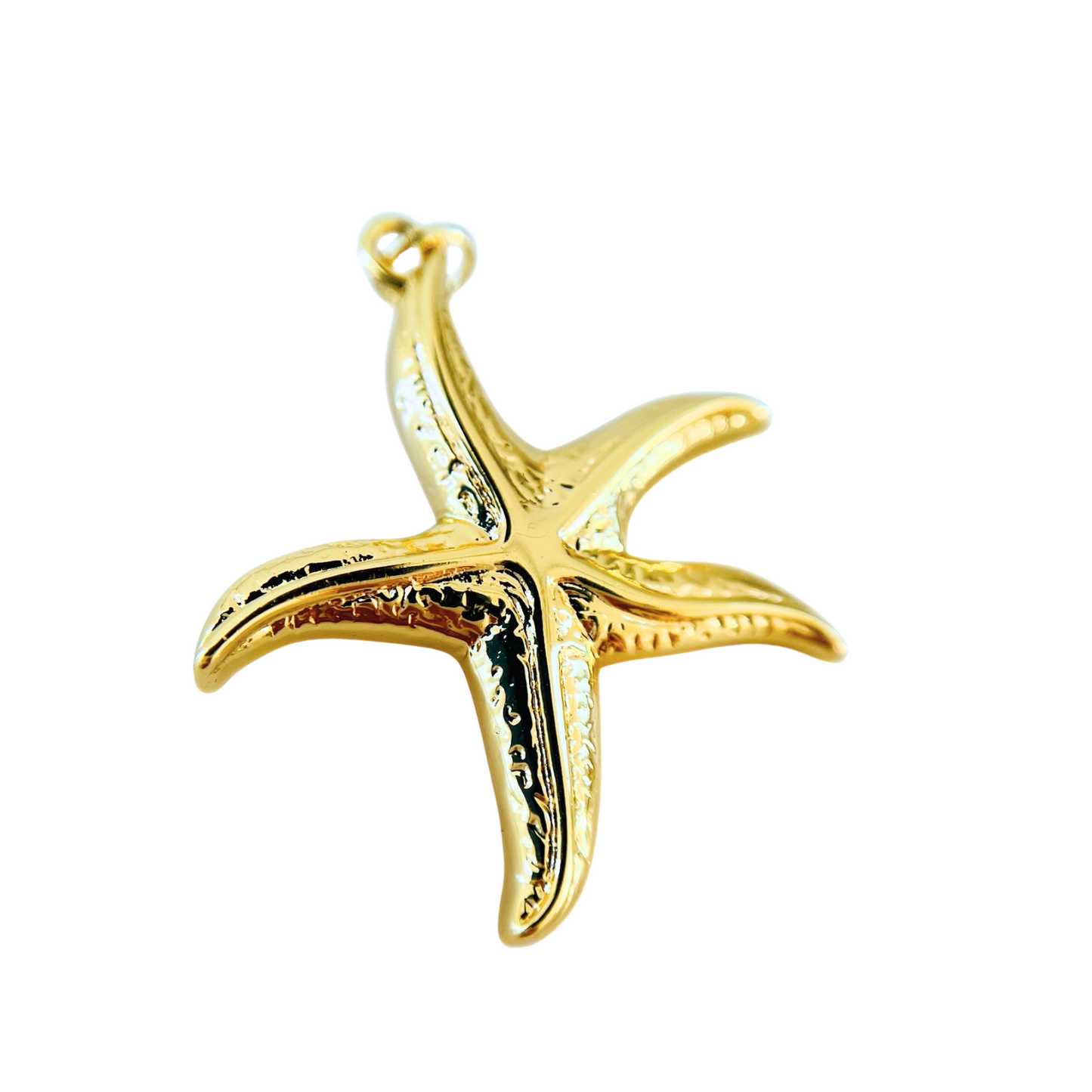 Gold starfish pendant on a white background