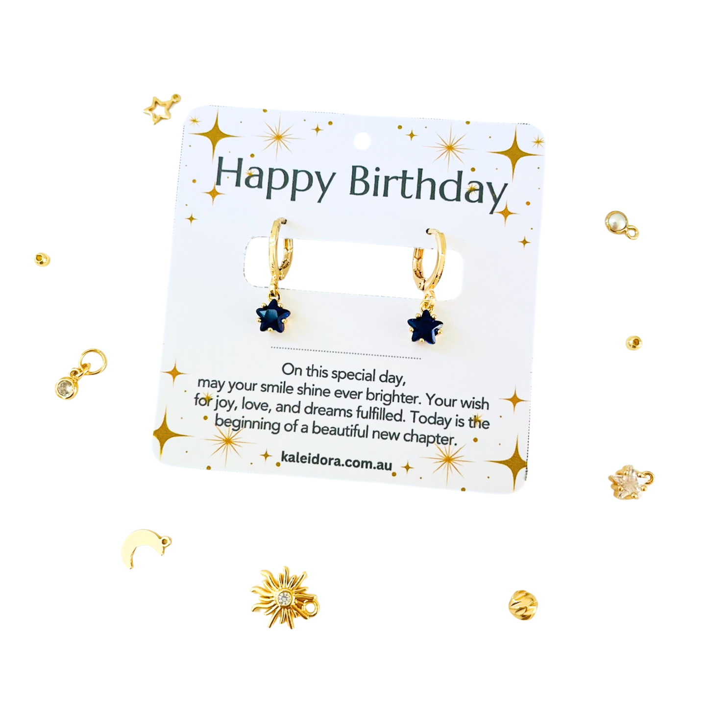 September Birthstone Sapphire CZ Star Hoop Earrings on a 'Happy Birthday' card on a light  background