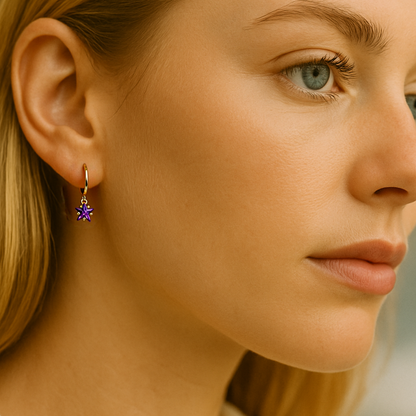 Close-up of a woman wearing a purple earring with a blurred background