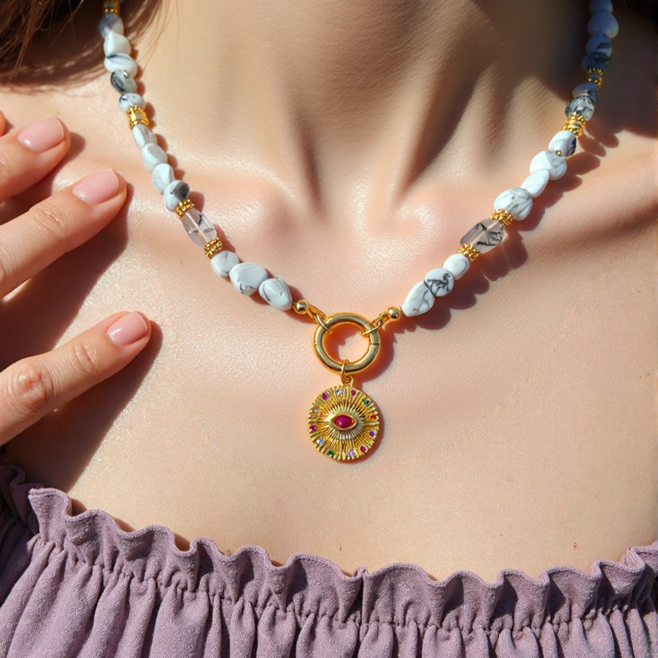 natural howlite gemstone Necklace Gold Plated Evil Eye Round Pendant with Magenta CZ - Protection Jewelry worn by a women, with a focus on the jewelry.