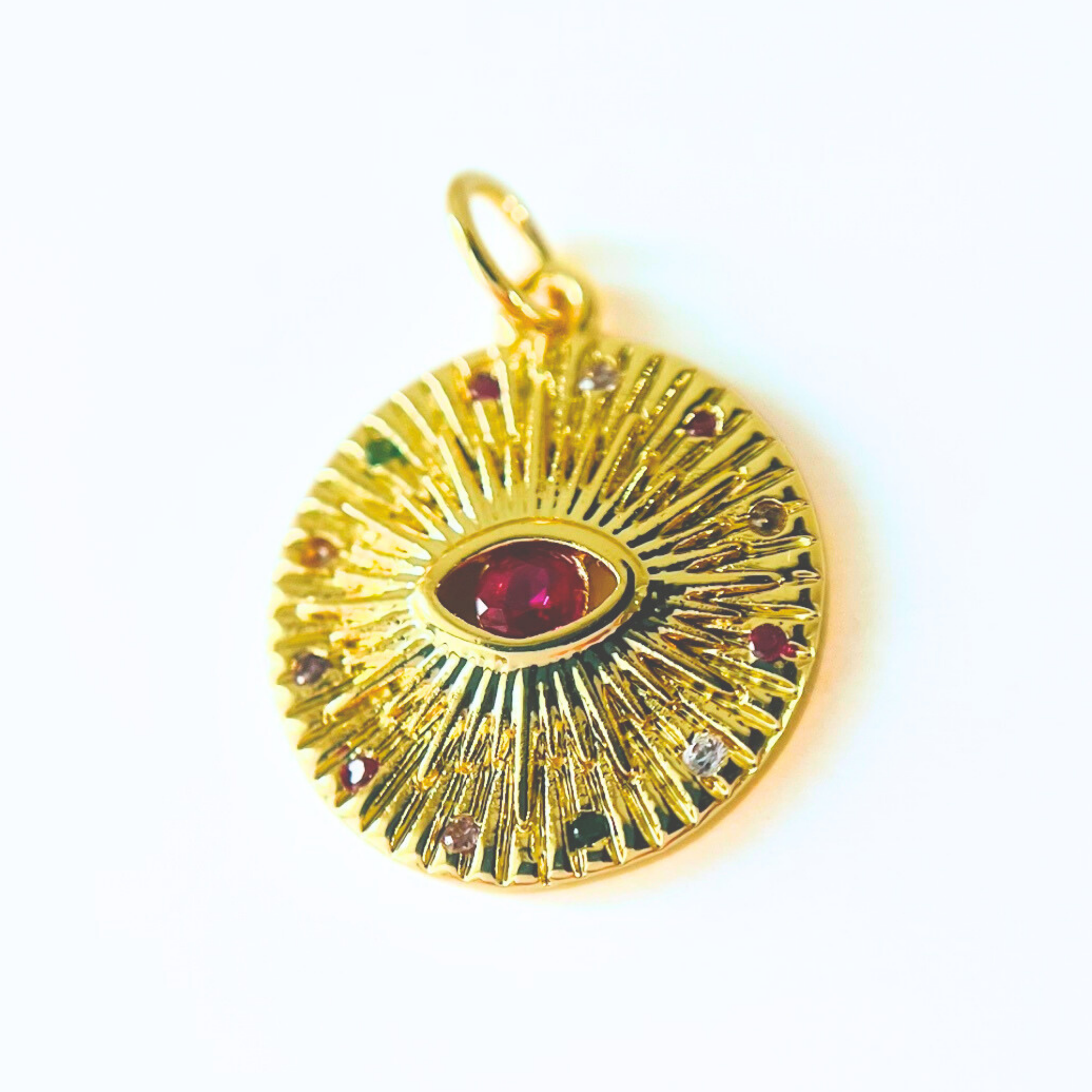 Gold Plated Evil Eye Round Pendant with Magenta CZ on a white background