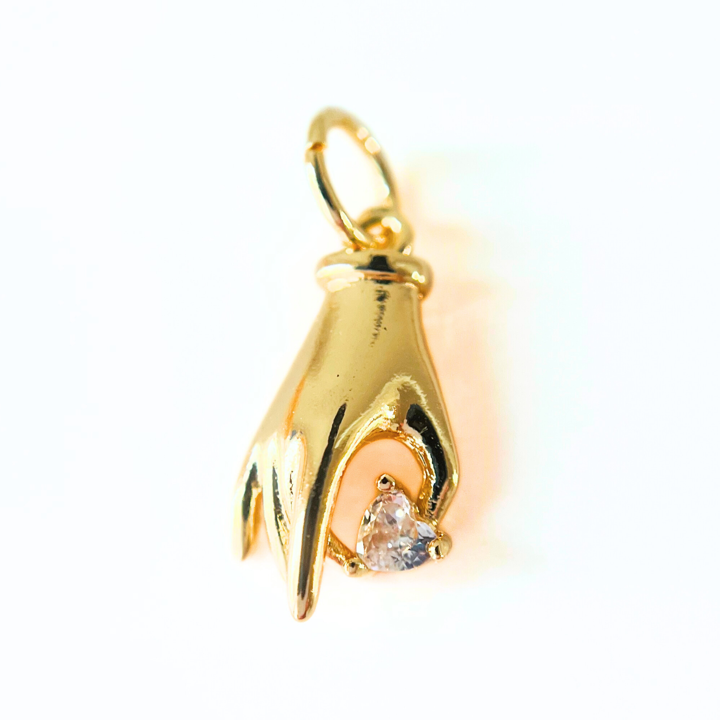 Gold Plated Hand Heart CZ Pendant on a white background