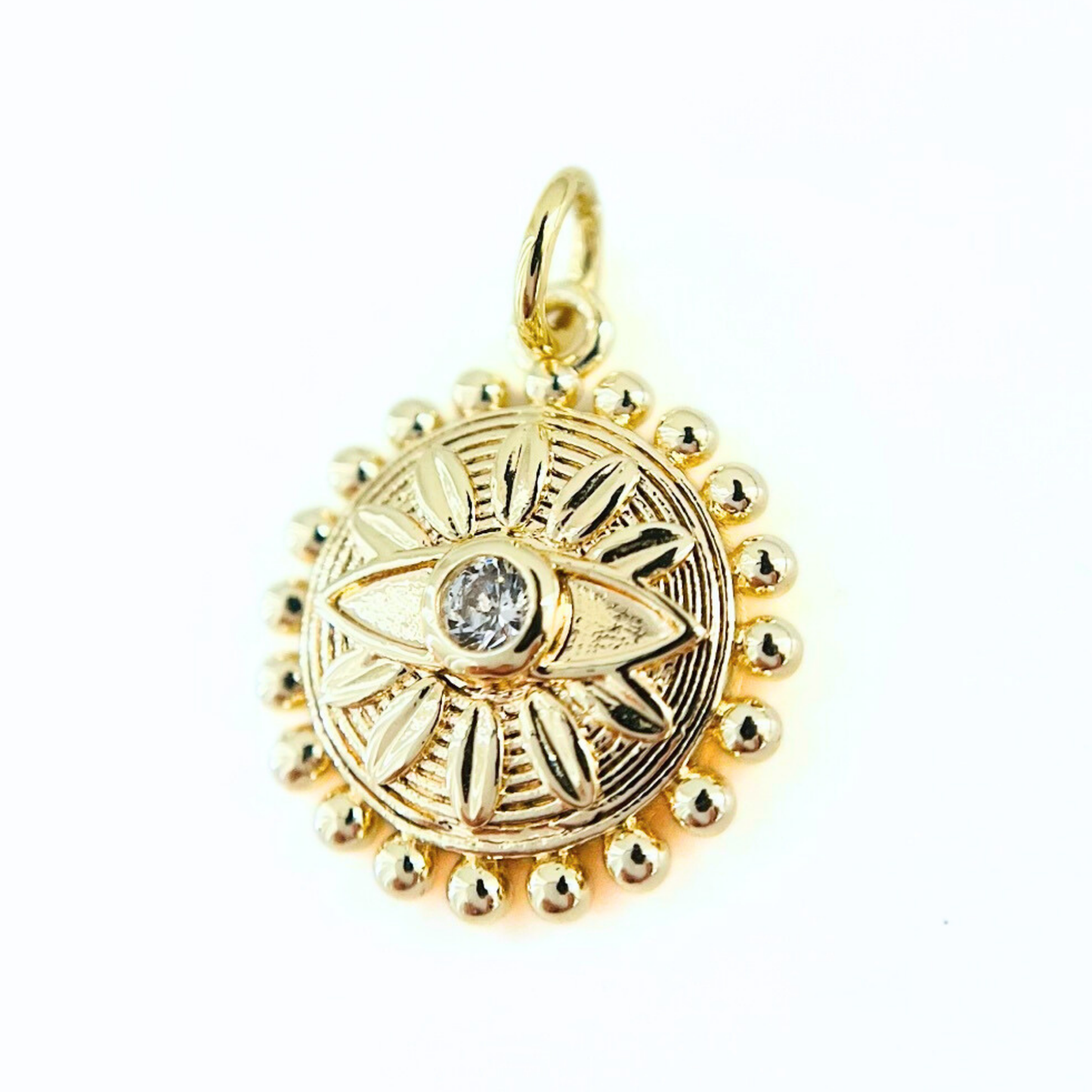 Gold Plated Sunburst CZ Evil Eye Pendanton a white background