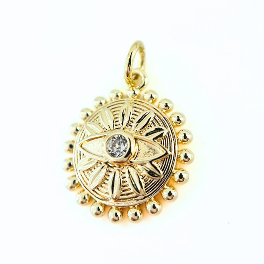 Gold Plated Sunburst CZ Evil Eye Pendanton a white background
