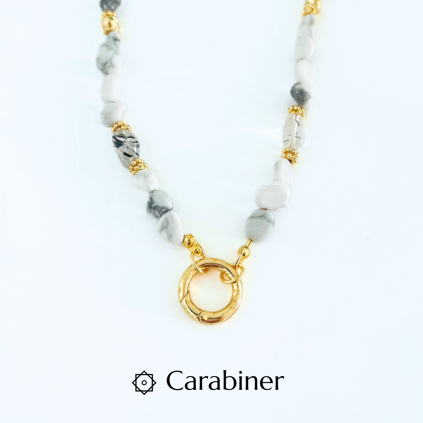 Natural Howlite Gemtsone Necklace with gold plated Canariner Clasp and pendant on a white background