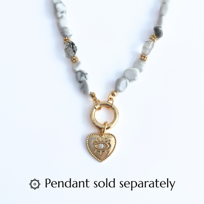 Natural Howlite Gemtsone Necklace with gold plated Canariner Clasp and  Evil Eye Heart Pendant on a white background, with text 'Pendant sold separately'.