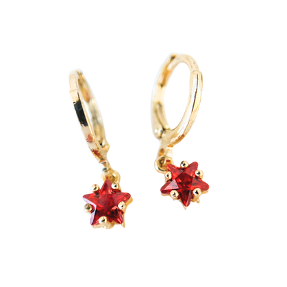Gold hoop earrings with red star-shaped gemstones on a white background
