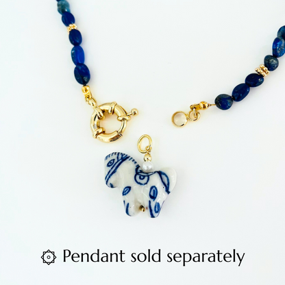 Lapis Lazuli Gemstone Necklace with a Gold Plated Bolt clasp and a porcelain hourse pendant on a white background, featuring a pendant sold separately text.