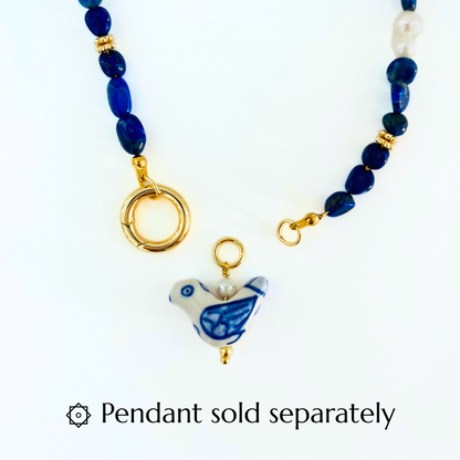 Lapis Lazuli & Pearl Gemstone Necklace with a Gold Plated Interchangeable Canariner clasp and a porcelain hourse pendant on a white background, with text 'Pendant sold separately'.