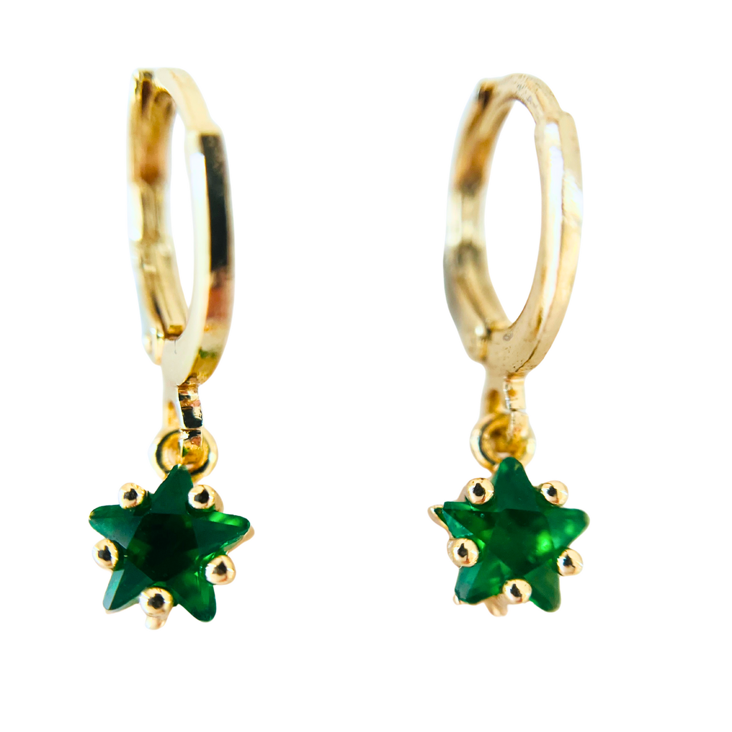 Gold hoop earrings with green gemstones on a white background