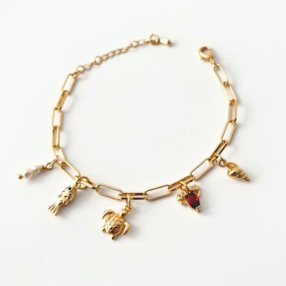 Sea creatures bracelet with various charms on a white background
