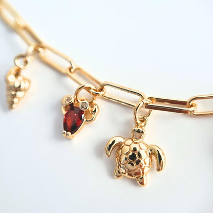 Close looking lobster charm and sea turtle charm