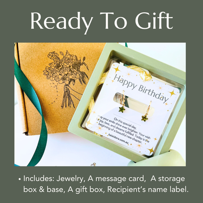 Jewelry set with a message card, storage box, and gift box on a white background.